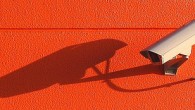 Security Camera on Orange Background
