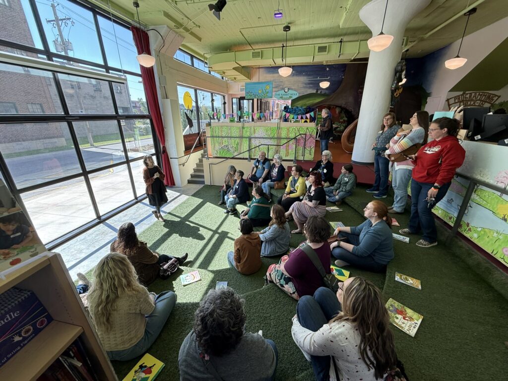 Visitors listen to The Rabbit hOle founder in the museum's bookstore.